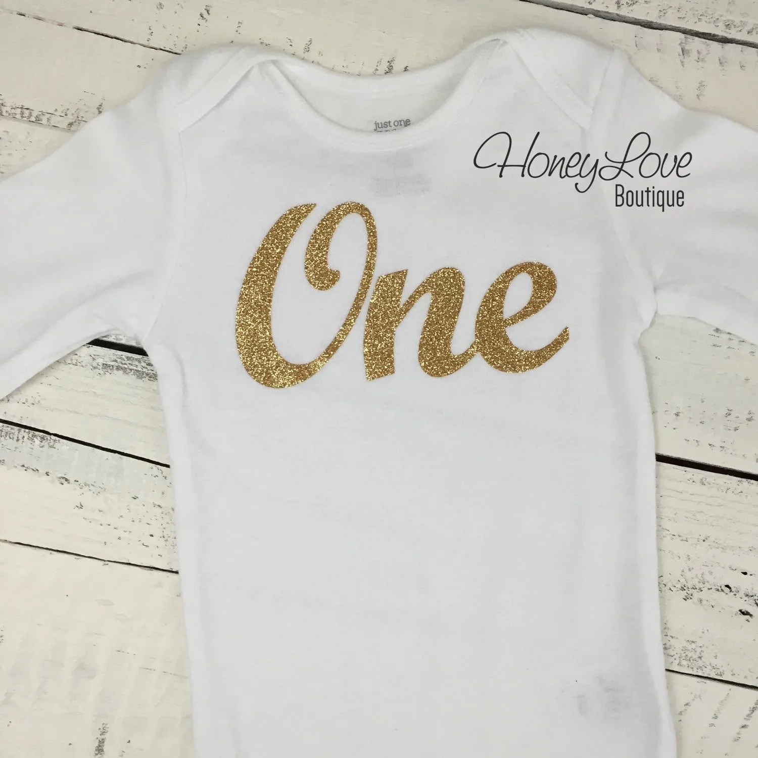 One - gold glitter bodysuit