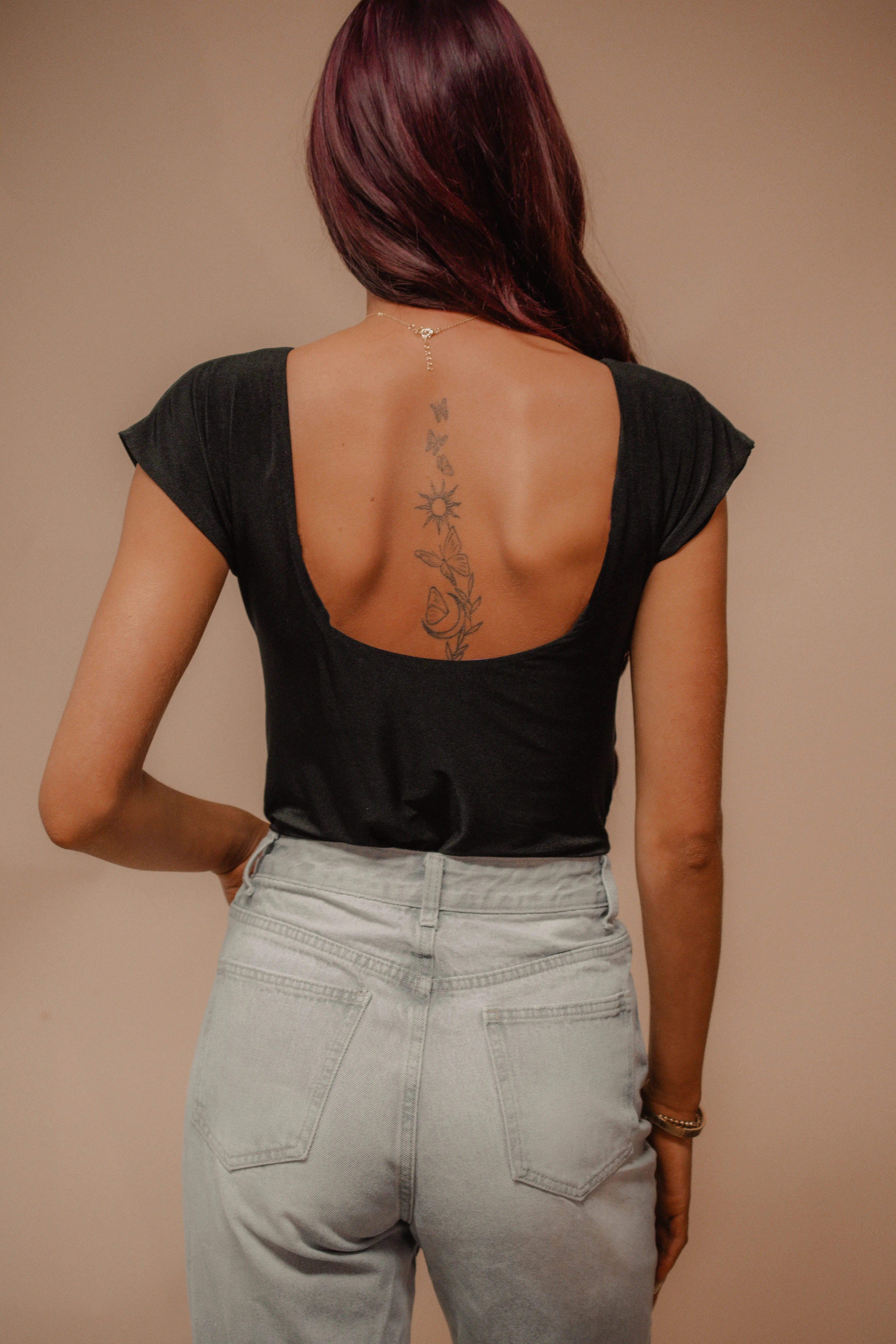 open back black bodysuit